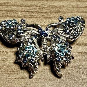 Elegant Silver Butterfly Brooch with Blue Accents